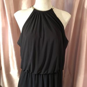 Black cocktail dress gold collar.